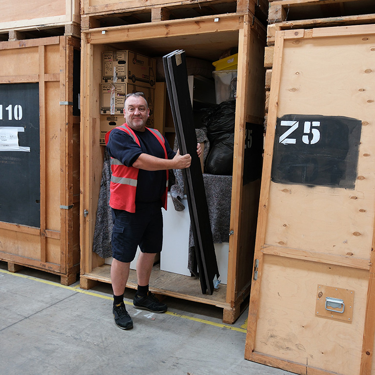 Secure container storage units at Goodwins Removals & Storage facility in Stafford, stacked and ready for customer use.