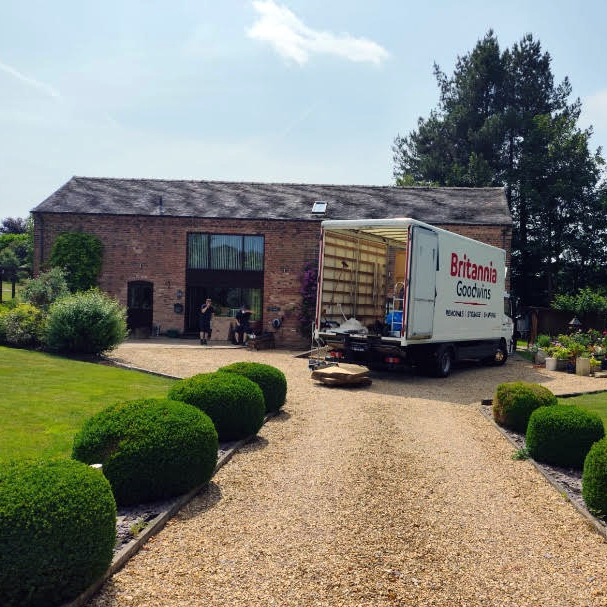 Goodwins Removals & Storage van parked outside a residential home in Staffordshire, ready for a house move.
